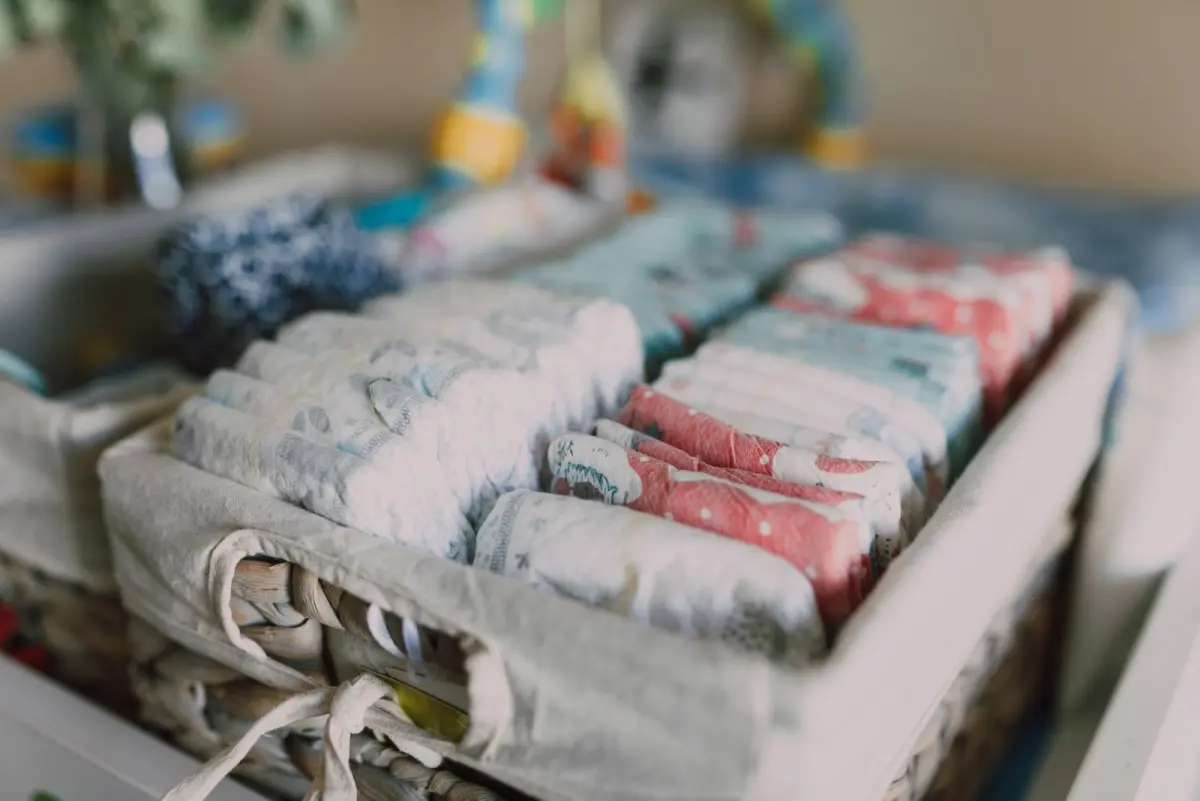 Folded disposable diapers sorted in a woven basket