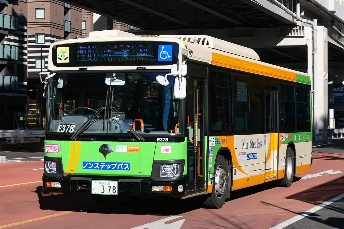 Green Toei city bus, a non-step bus, at Shibuya in Tokyo
