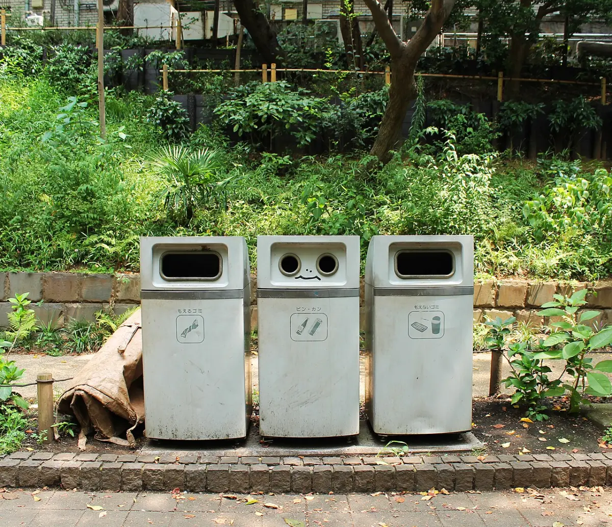 Three sorted trash bins for burnable waste, bottles and cans at Ueno Park, Tokyo