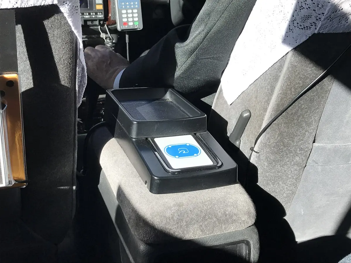 Card and IC payment reader mounted for rear-seat passengers inside a Japanese taxi