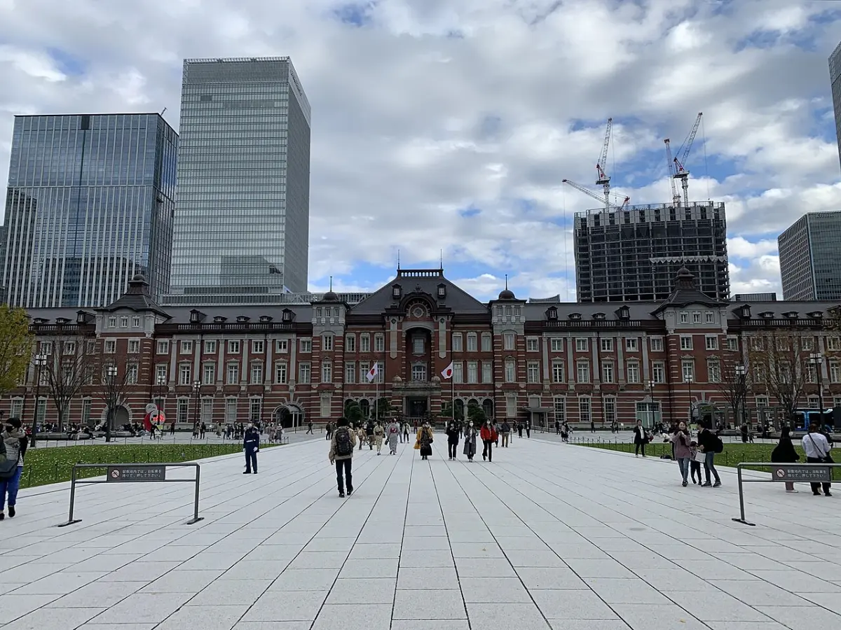 Red-brick Marunouchi building of Tokyo Station seen from the plaza, with office towers behind