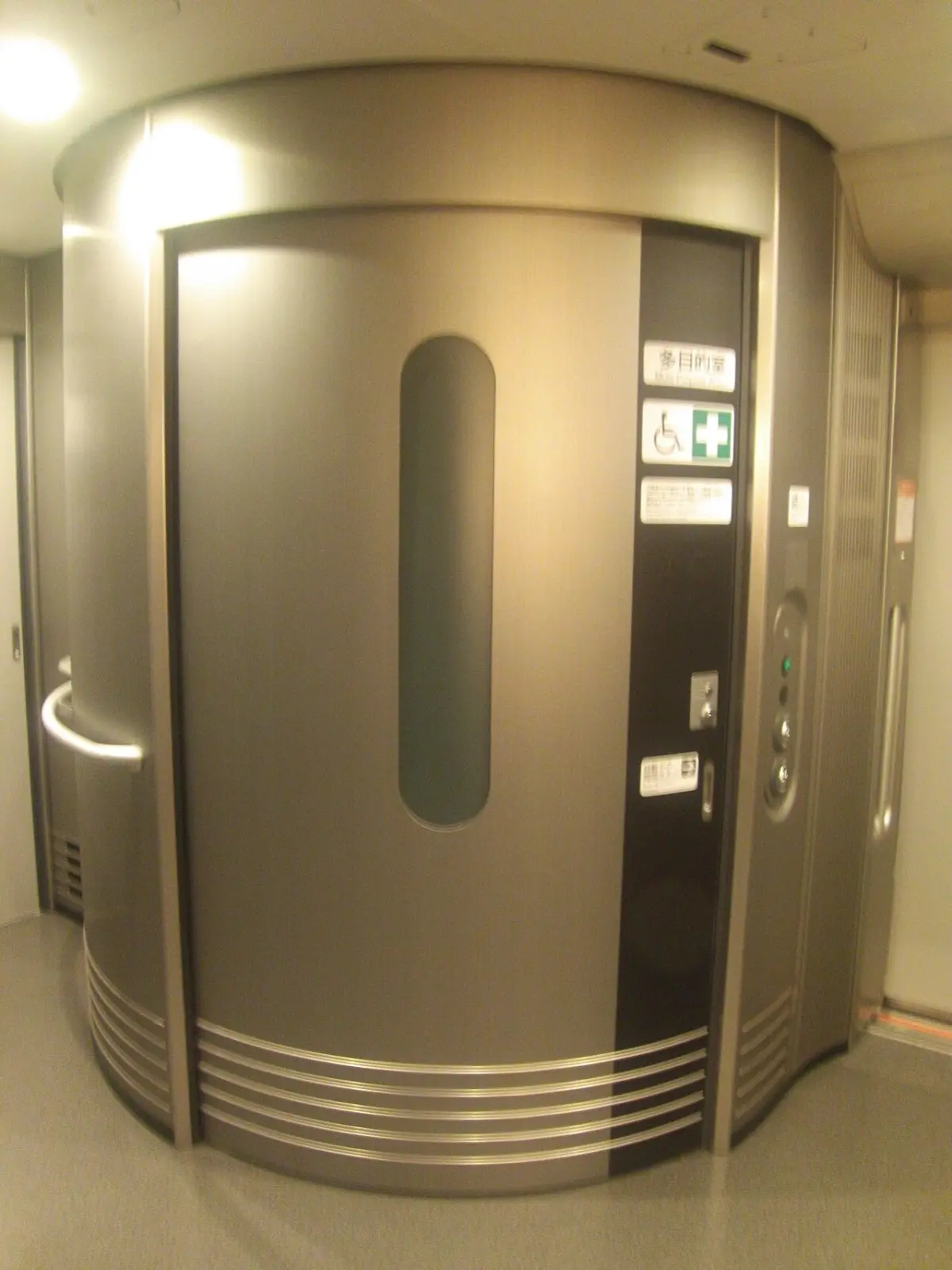 Door of the multi-purpose room on a Tokaido Shinkansen N700S train