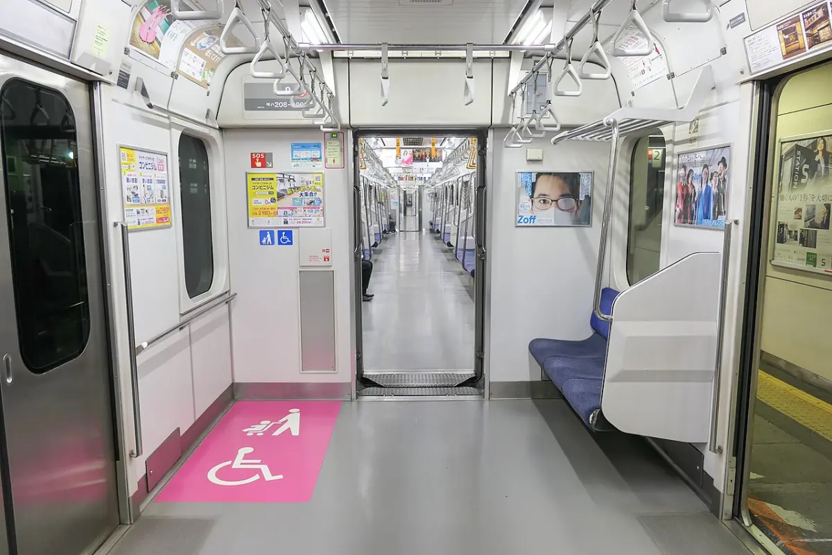Marked wheelchair and stroller space inside a JR East commuter train car