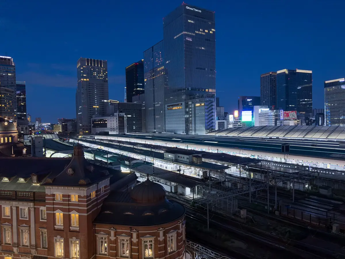 Evening view from KITTE Garden rooftop over the Tokyo Station building and its train tracks